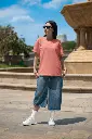 bella-canvas-t-shirt-mockup-featuring-a-woman-with-sunglasses-posing-near-a-fountain-m40208 (1)(1).webp