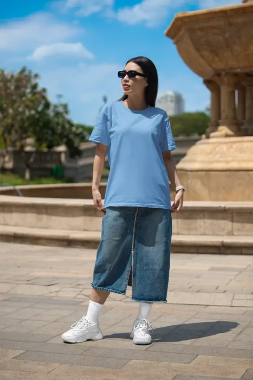 bella-canvas-t-shirt-mockup-featuring-a-woman-with-sunglasses-posing-near-a-fountain-m40208 (1)-copy-0.webp