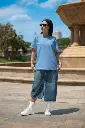 bella-canvas-t-shirt-mockup-featuring-a-woman-with-sunglasses-posing-near-a-fountain-m40208 (1)-copy-0.webp